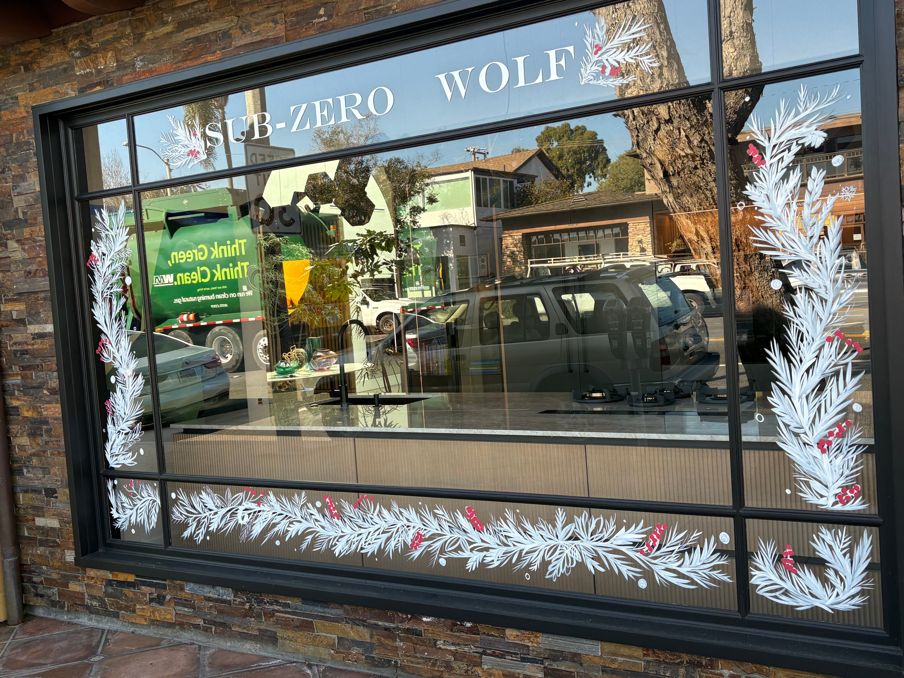 Sub-Zero Wolf storefront holiday window painting by Shannon Paints